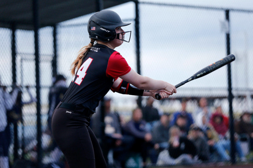 Snohomish’s Skyla Bristol watches the ball fly after getting a hit against Everett during Tuesday’s Class 3A District 1 matchup at the Phil Johnson Ballfields in Everett. (Ryan Berry / The Herald)
