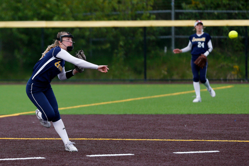 Everett’s Isa Davis throws over to first against Snohomish during Tuesday’s Class 3A District 1 matchup at the Phil Johnson Ballfields in Everett. (Ryan Berry / The Herald)
