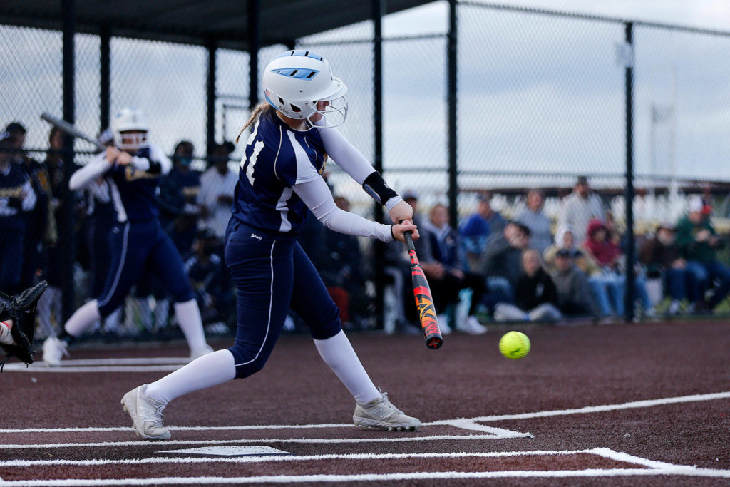 Everett’s Maddie Pewitt gets on base with a hit through the infield against Snohomish during Tuesday’s Class 3A District 1 matchup at the Phil Johnson Ballfields in Everett. (Ryan Berry / The Herald)
