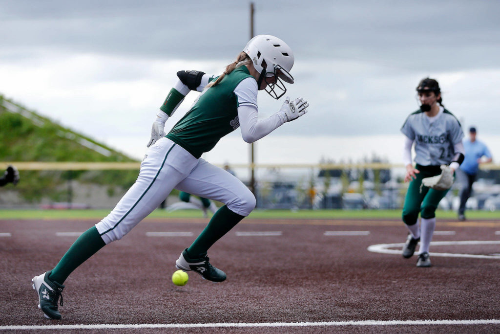 Skyline’s Macen Staley beats out a bunt against Jackson during Wednesday’s Class 4A matchup at the Phil Johnson Ballfields in Everett. (Ryan Berry / The Herald)
