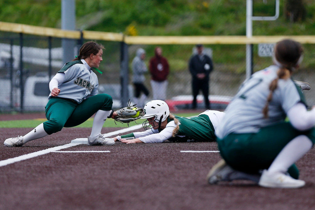 Skyline’s Ryan Grace slides in safely to third, setting herself up to score the game-winning run against Jackson during Wednesday’s Class 4A matchup at the Phil Johnson Ballfields in Everett. (Ryan Berry / The Herald)
