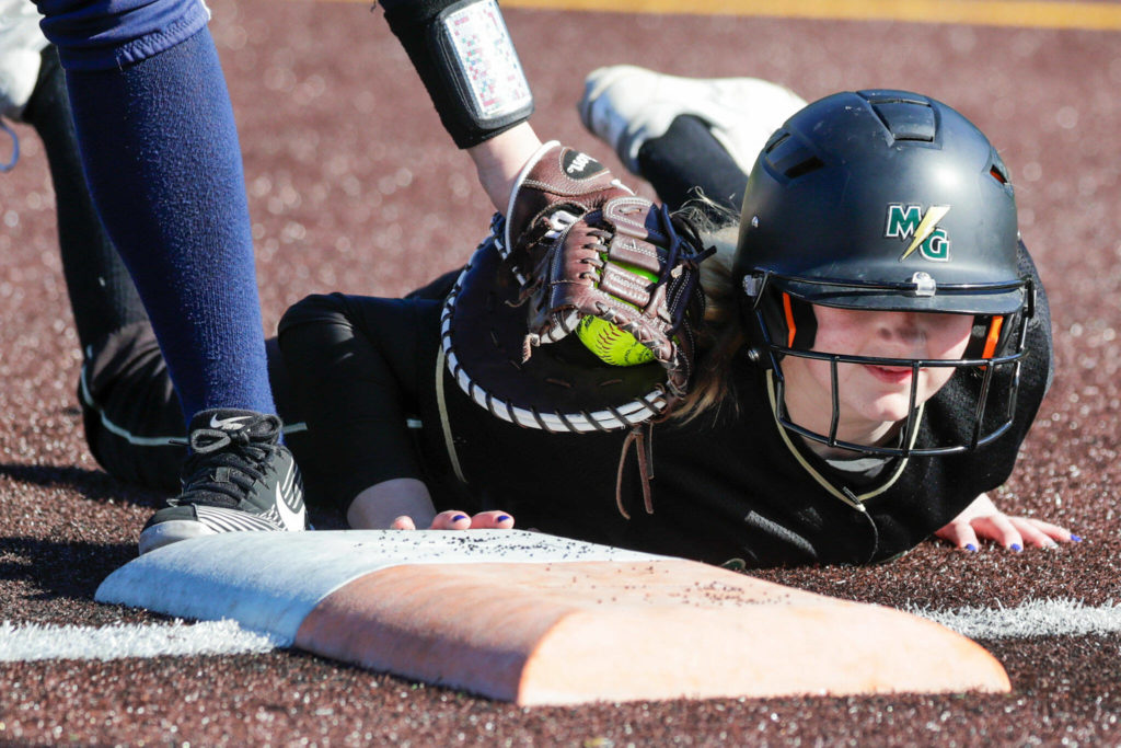 Marysviile-Getchell’s Erica Martin is safe at first against Everett High School at Phil Johnson Ball Field in Everett, Washington on May 19, 2022.(Kevin Clark / The Herald)
