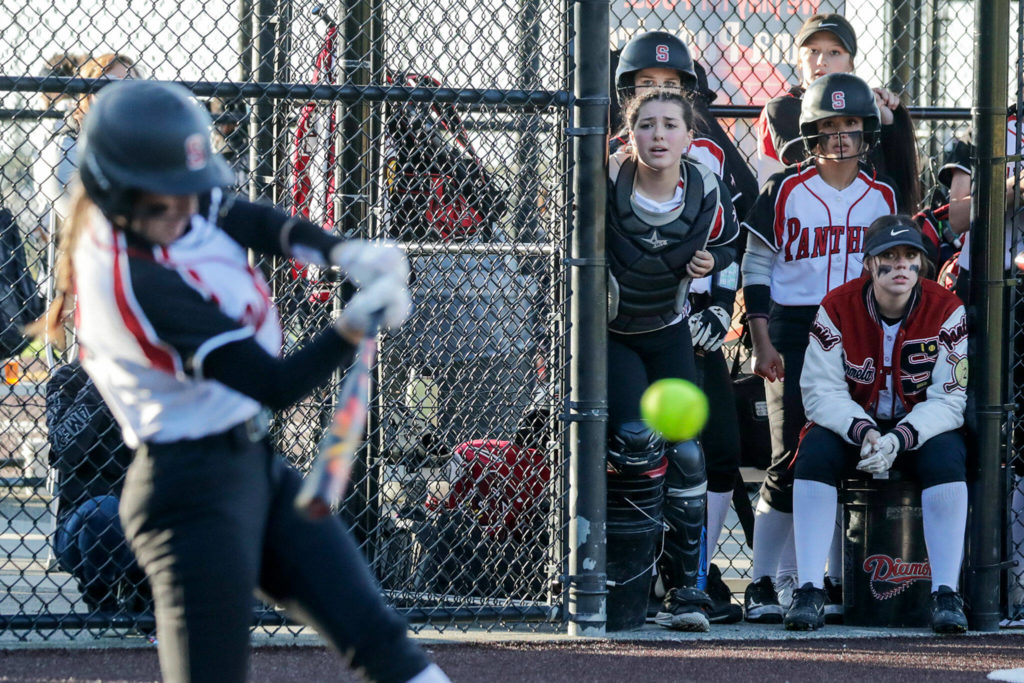 The Snohomish dugout watches Janell Williams at at against Cascade Thursday evening at Phil Johnson Ball Field in Everett, Washington on May 19, 2022. The Bruins defeated the Panthers 14-7 to claim the NW District 1 3A Championship title. (Kevin Clark / The Herald)
