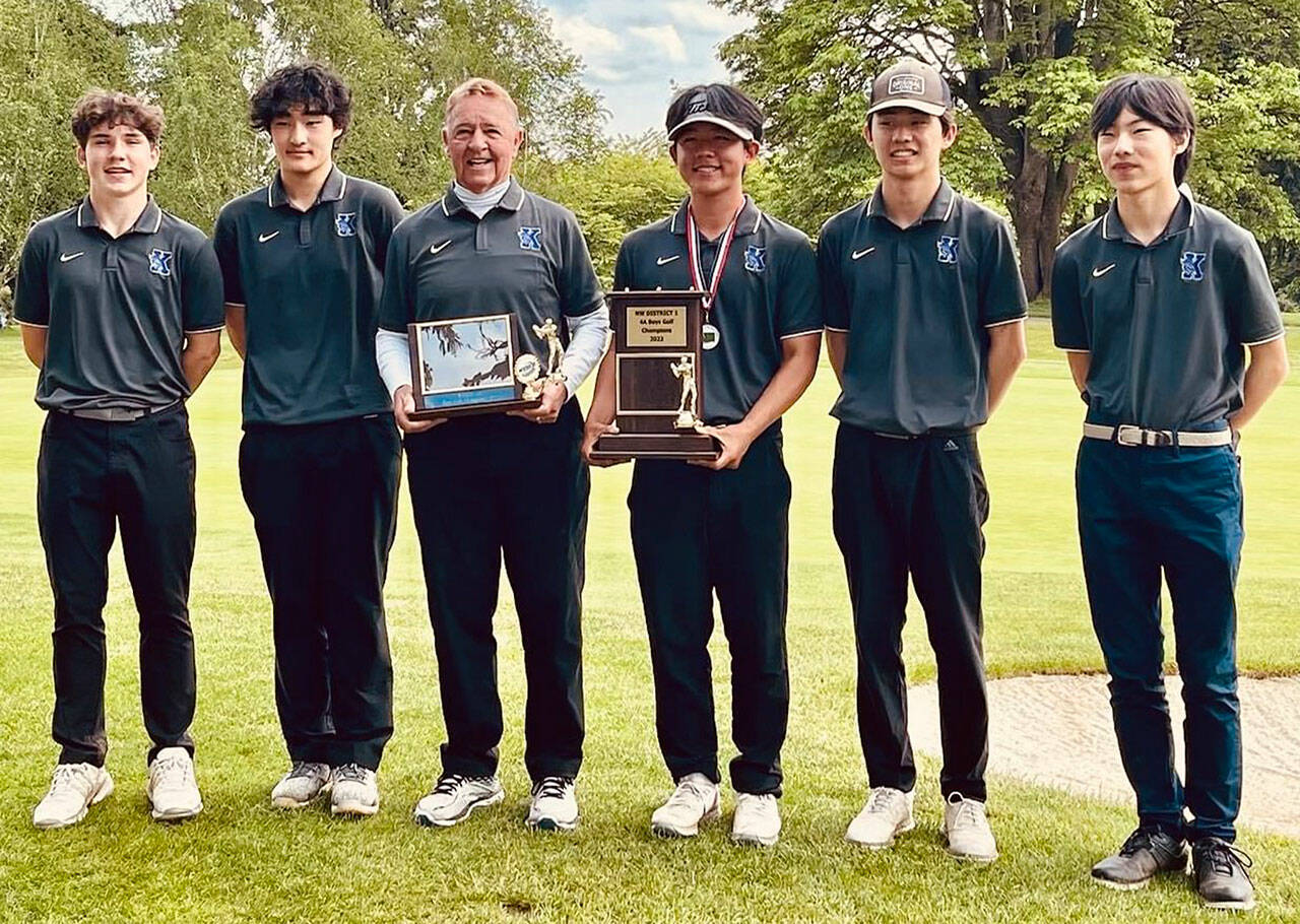 Kamiak’s Luke Strand (left to right), Brandon Yoon, coach Vic Alinen, Daniel Kim, Brandon Suh and Aaron Choi pose for a photo after winning the Class 4A District 1 team title on May 17. After capturing the 4A state crown in 2019, the Knights are looking to repeat as state champions. (Contributed photo)