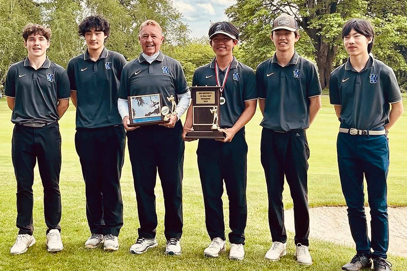 Kamiak's Luke Strand (left to right), Brandon Yoon, coach Vic Alinen, Daniel Kim, Brandon Suh and Aaron Choi pose for a photo after winning the Class 4A Distrcit 1 Tournament on May 17, 2022, at Legion Memorial Golf Course in Everett. (Contributed photo)