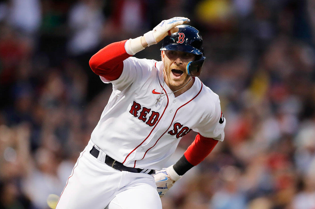 Boston Red Sox’s Trevor Story looks to the dugout after hitting a grand slam against the Seattle Mariners during a game Friday in Boston. (AP Photo/Michael Dwyer)