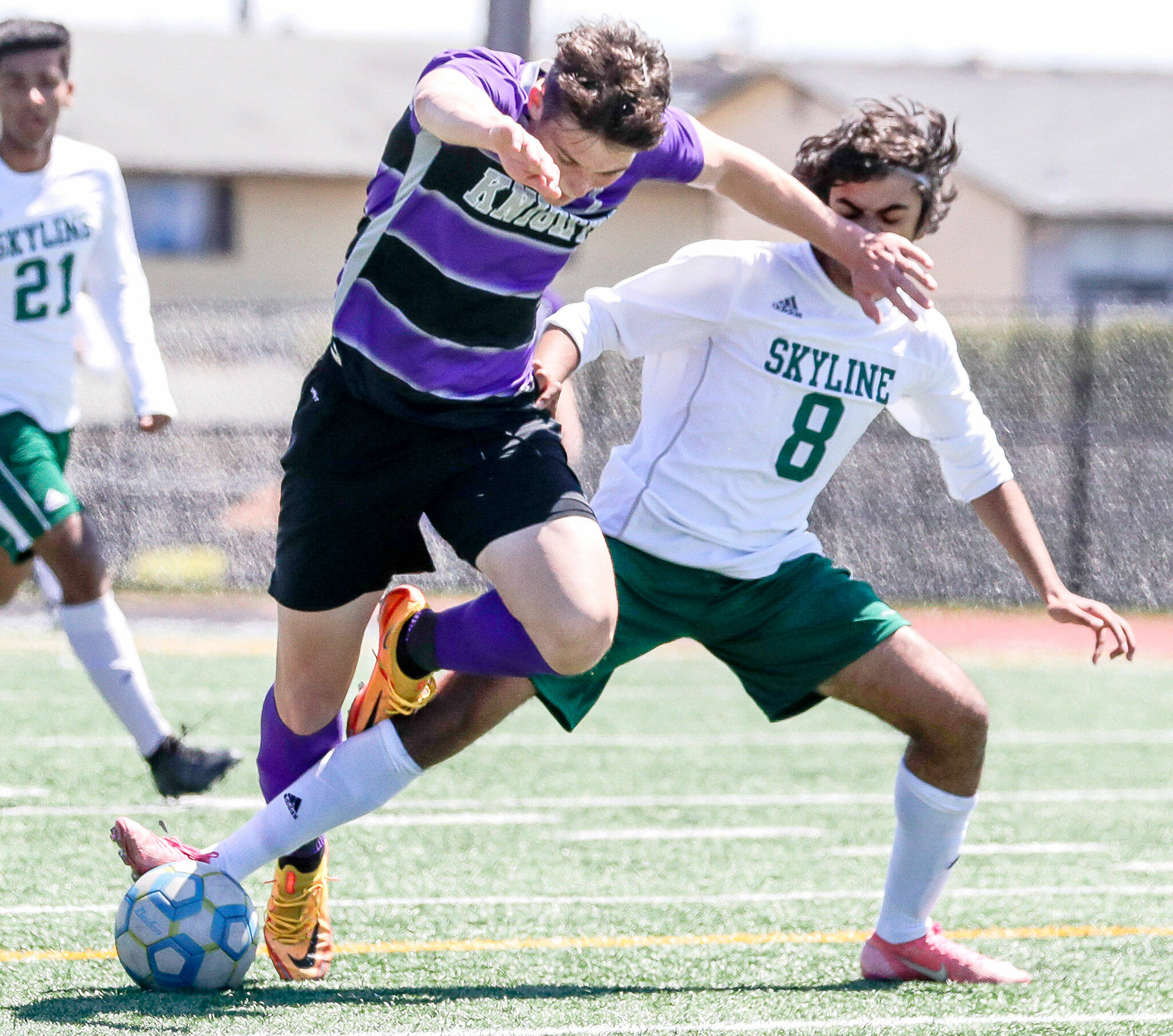 Kamiak’s Koll Pehlivanian’s charge is halted by Skyline’s Vishnu Varadhan during a Class 4A state quarterfinal game Saturday afternoon at Goddard Stadium in Everett. The Knights lost 5-2. (Kevin Clark / The Herald)