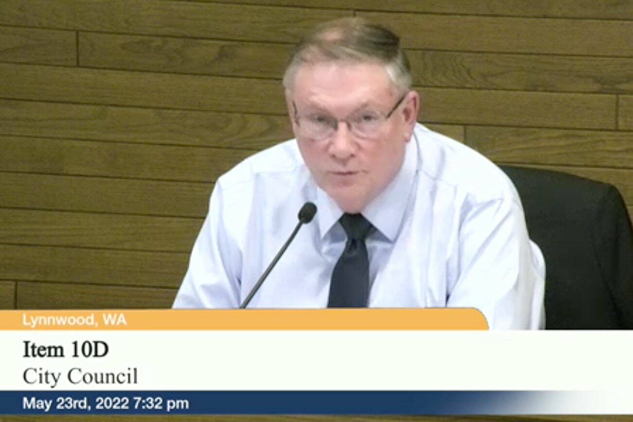 Lynnwood City Council member George Hurst moves to postpone action on the vehicle license fees ordinance during the council's meeting Monday. (Screenshot/City of Lynnwood)