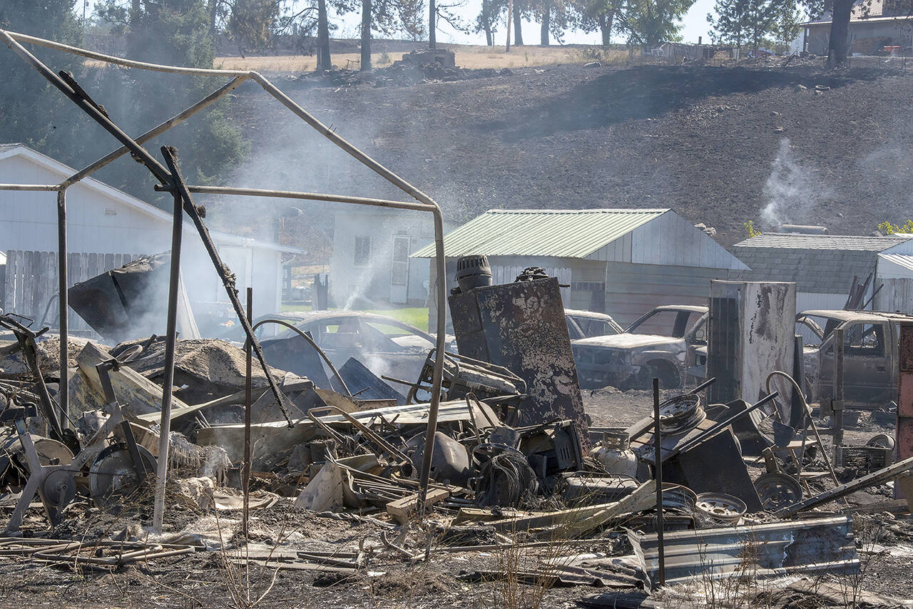 Fire destroyed much of the town of Malden, Wash., in 2020 after a tree reportedly snapped and fell into power lines operated by Avista. (Jed Conklin / Associated Press file photo)