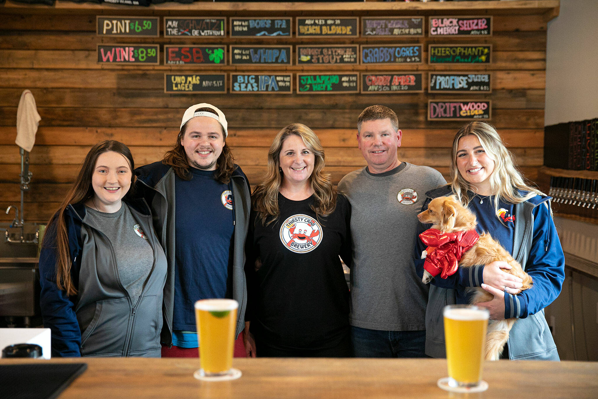 From left, Rachael Carrigan, Nate Hanson, Erin Hanson, Jeff Hanson and Kacie Hanson pose for a group photo at Thirsty Crab Brewery in Clinton. (Ryan Berry / The Herald)