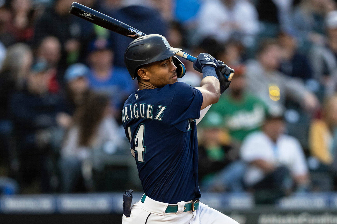 Seattle Mariners' Julio Rodriguez hits a single off Oakland Athletics starting pitcher Zach Logue during the fifth inning of a baseball game, Monday, May 23, 2022, in Seattle. (AP Photo/Stephen Brashear)