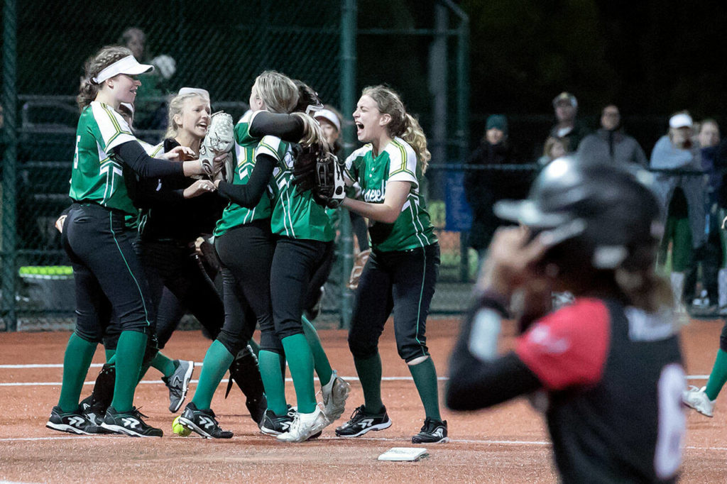 Roosevelt celebrates the change over and the chance to win against Snohomish during 3A quarter-final game Friday evening in Lacey, Washington on May 27, 2022. The Panthers lost 14-13 in 8 innings. (Kevin Clark / The Herald)
