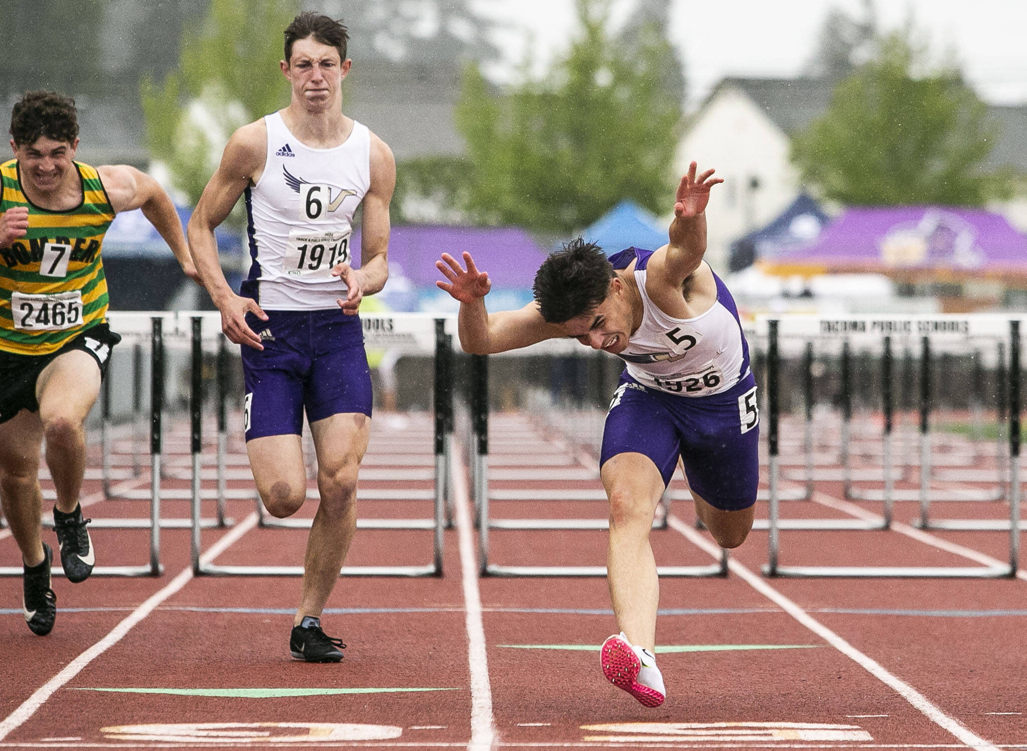 Lake Stevens’ Sean Martelles dives across the finish line at the end of the 4A 110 Meter Hurdles during the state track and field championships on Friday, May 27, 2022 in Tacoma, Washington. (Olivia Vanni / The Herald)