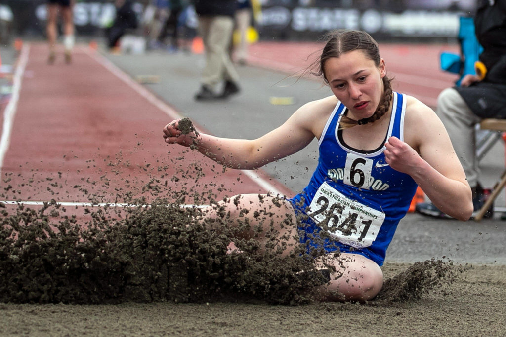 Shorewood’s Gilana Woollman land in the long jump during State Track Championships Friday evening in Lacey, Washington on May 28, 2022. (Kevin Clark / The Herald)
