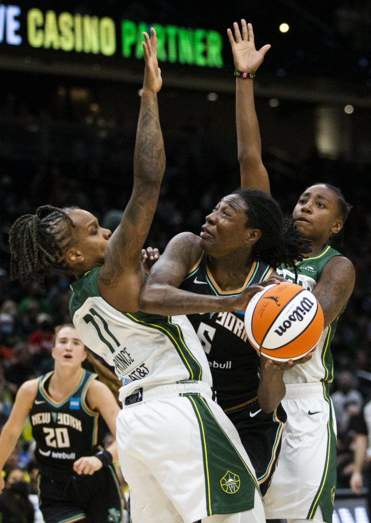 Seattle Storm’s Epiphanny Prince and Jewell Loyd double team New York Liberty’s Natasha Howard during the game on Sunday, May 29, 2022 in Seattle, Washington. (Olivia Vanni / The Herald)
