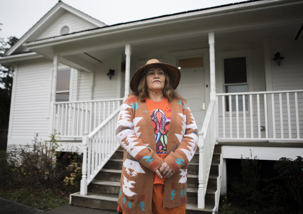 Tulalip Tribes Chairwoman Teri Gobin stands outside the former office building of the Tulalip Indian Agent on the Tulalip Reservation. (Olivia Vanni / The Herald)
