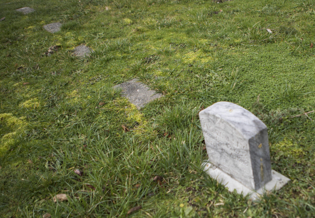Unmarked graves dot the Priest Point cemetery on the Tulalip Reservation in 2022. (Olivia Vanni / The Herald)
