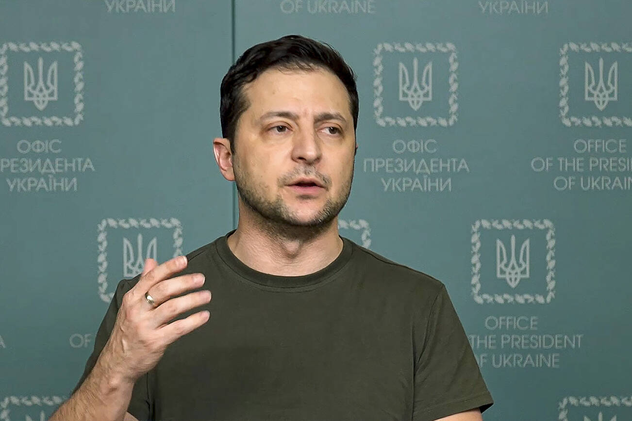 In this photo taken from video provided by the Ukrainian Presidential Press Office, Ukrainian President Volodymyr Zelenskyy speaks to the nation in Kyiv, Ukraine, Sunday, Feb. 27, 2022. Street fighting broke out in Ukraine's second-largest city Sunday and Russian troops put increasing pressure on strategic ports in the country's south following a wave of attacks on airfields and fuel facilities elsewhere that appeared to mark a new phase of Russia's invasion. (Ukrainian Presidential Press Office via AP)