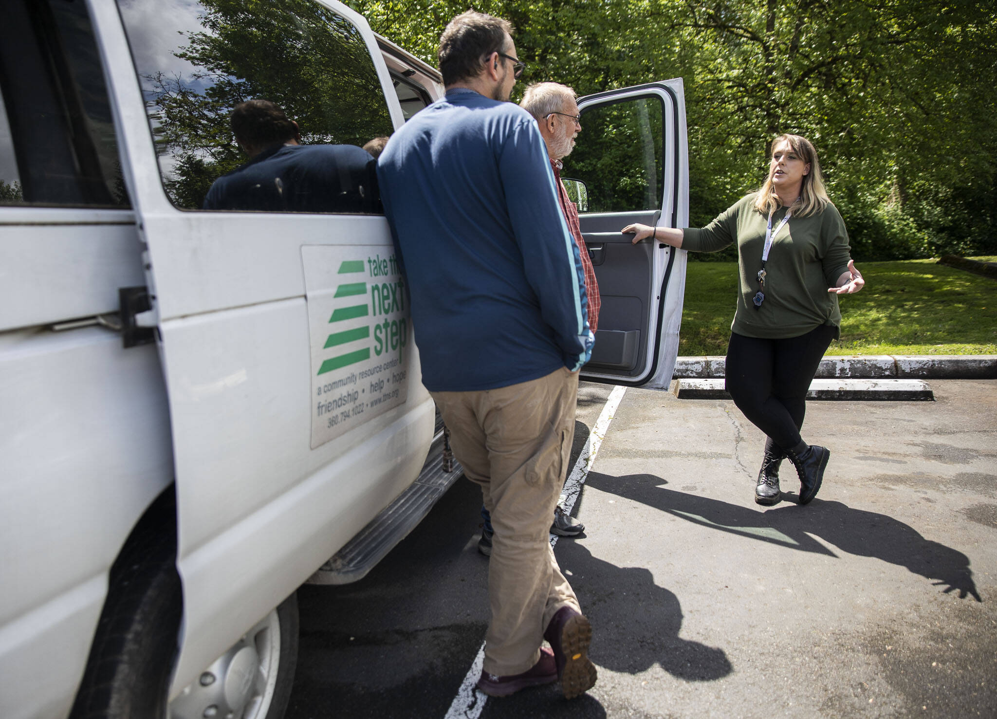 April Provost, a community outreach peer for Ideal Option, speaks with resource outreach staff from Take the Next Step on May 25 at the Monroe Library. (Olivia Vanni / The Herald)