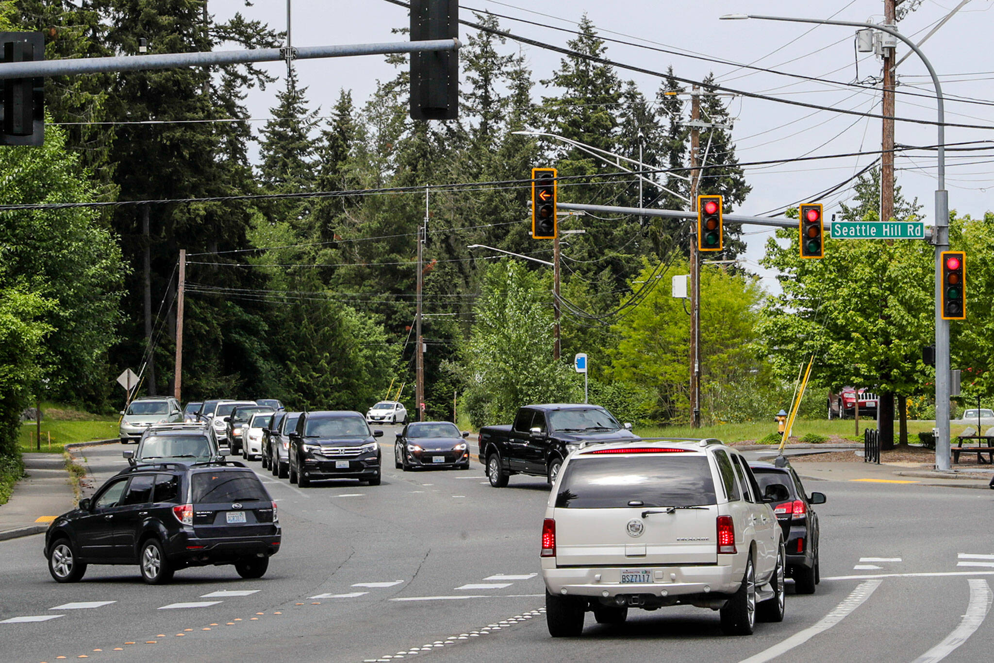 A driver turns left from 35th Avenue SE to westbound Seattle Hill Road on Wednesday in Mill Creek. The left turn signal doesn’t have a flashing yellow arrow, which can keep drivers waiting for the next cycle. (Kevin Clark / The Herald)