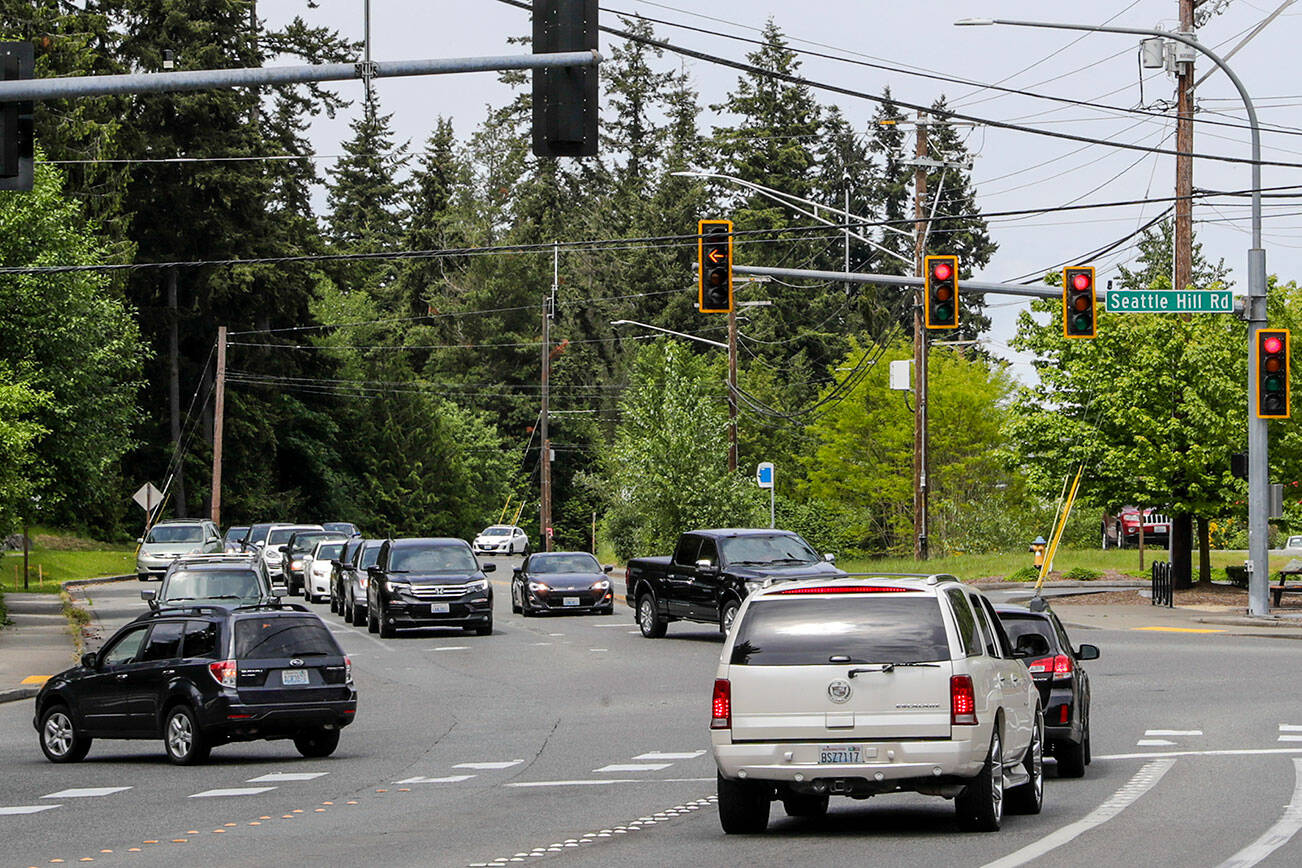 A vehicle turns left, westbound on 35th Ave SE from Seattle Hill Rd in Mill Creek, Washington on June 2, 2022. (Kevin Clark / The Herald)