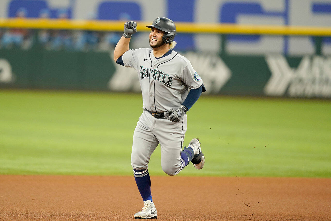 Seattle Mariners’ Eugenio Suarez runs the bases after hitting a solo home run during the fourth inning of a game Sunday against the Texas Rangers in Arlington, Texas. (AP Photo/LM Otero)