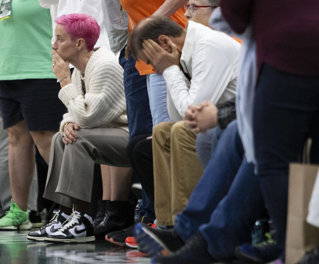 Megan Rapinoe and other Storm fans react to the loss against the Connecticut Sun during the final seconds of the game on Sunday, June 5, 2022 in Seattle, Washington. (Olivia Vanni / The Herald)
