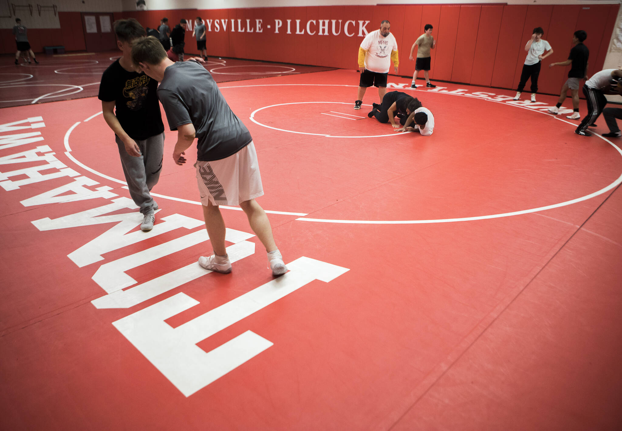 Tony Hatch coaches wrestling practice at Marysville Pilchuck High School in 2021 in Marysville. (Olivia Vanni / The Herald)