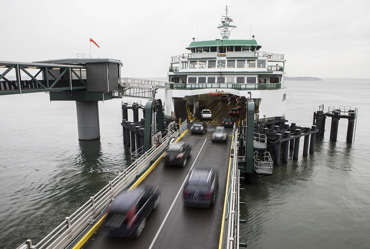 Vehicles board the ferry to Whidbey Island at the Mukilteo dock. (Olivia Vanni / The Herald)