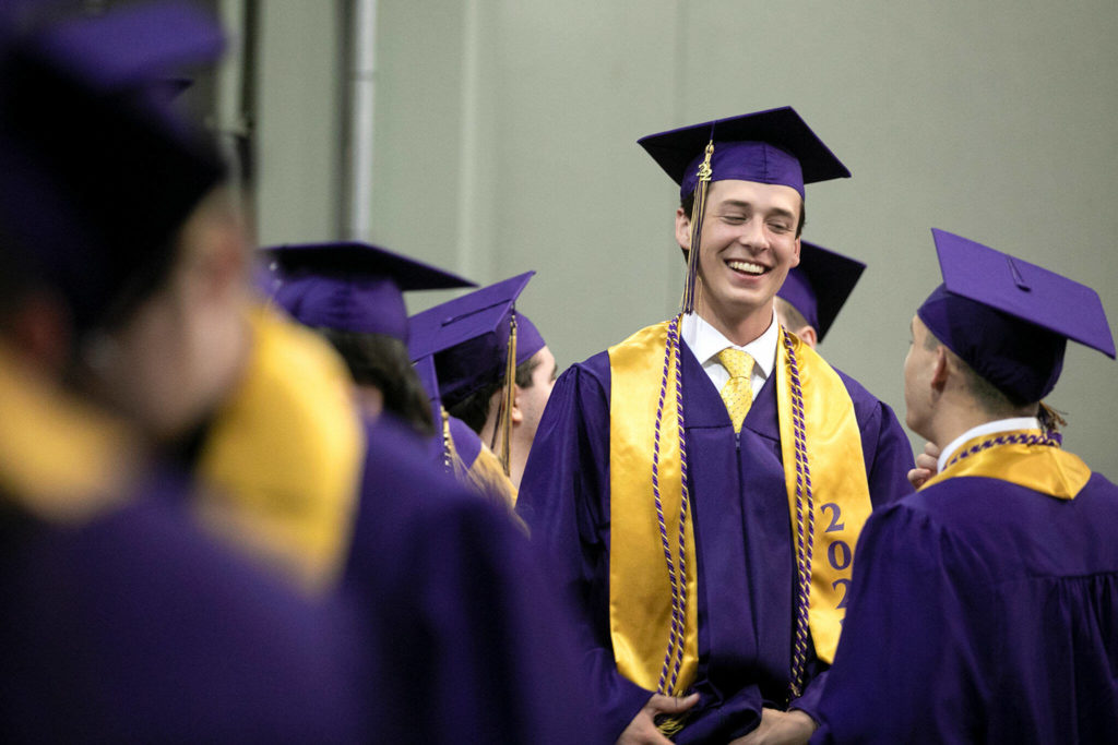 Soon-to-be graduates line up for their entrance at Lake Stevens High School’s 2022 commencement ceremony Tuesday at Angel of the Winds Arena in Everett. (Ryan Berry / The Herald)
