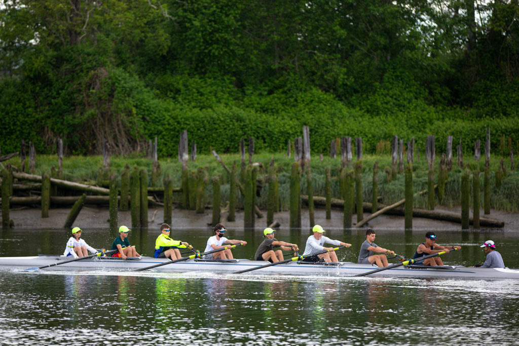 Members of Everett Rowing Association&rsquo;s boys U16 8+ group head up the Snohomish River during practice June 2 at Langus Riverfront Park in Everett. (Ryan Berry / The Herald)
