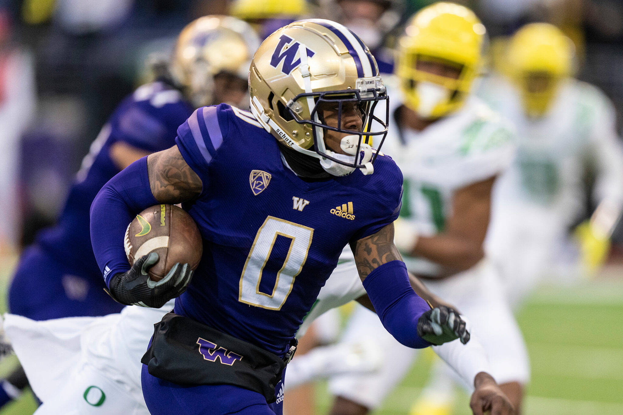 Washington wide receiver Giles Jackson runs with the ball during a game against Oregon on Nov. 6, 2021, in Seattle. (AP Photo/Stephen Brashear)
