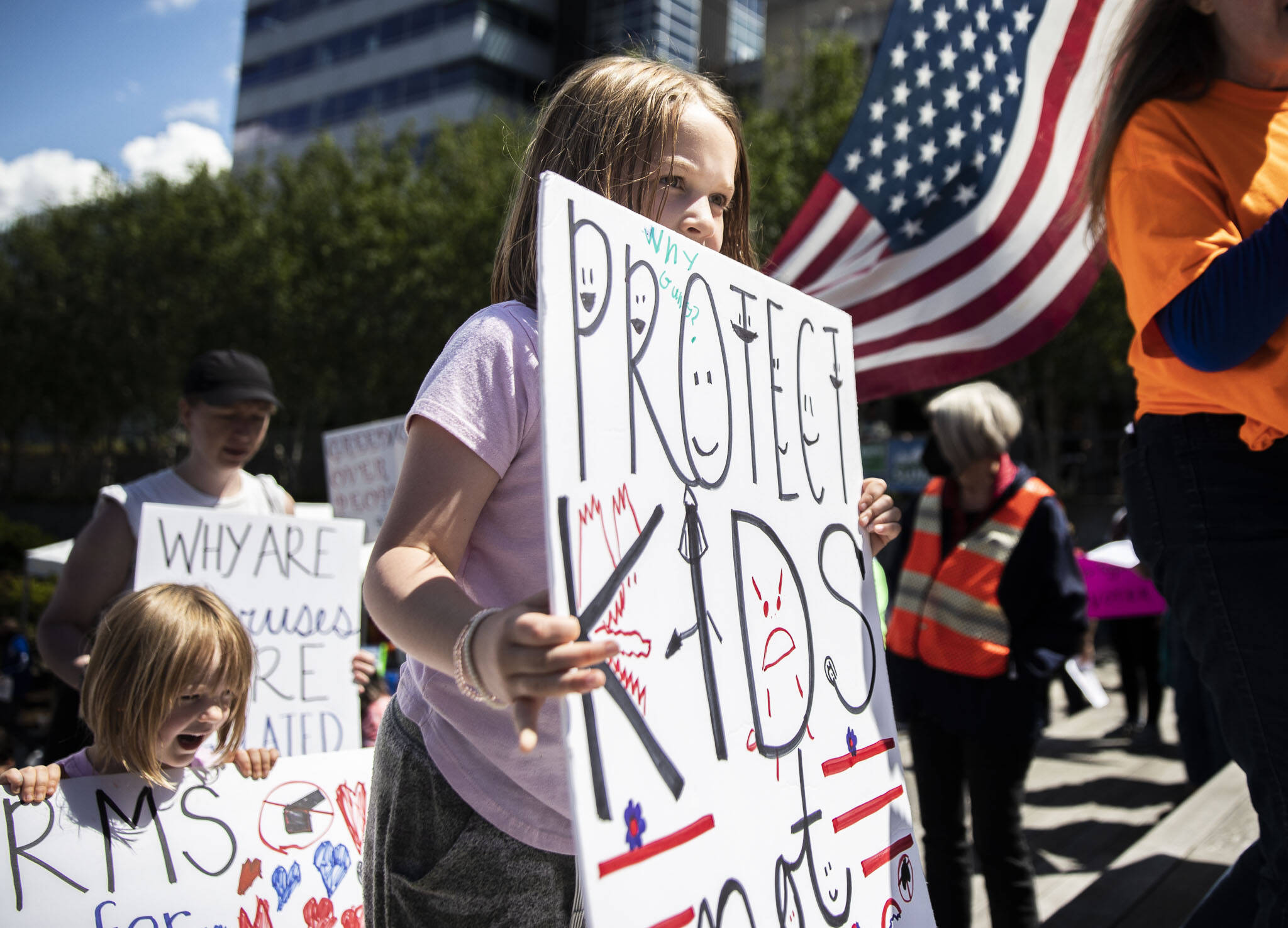 Flo Tremper, 8, who is a second grader, helps lead the start of the March for Our Lives from the Snohomish County Courthouse Plaza on Saturday in Everett. (Olivia Vanni / The Herald)