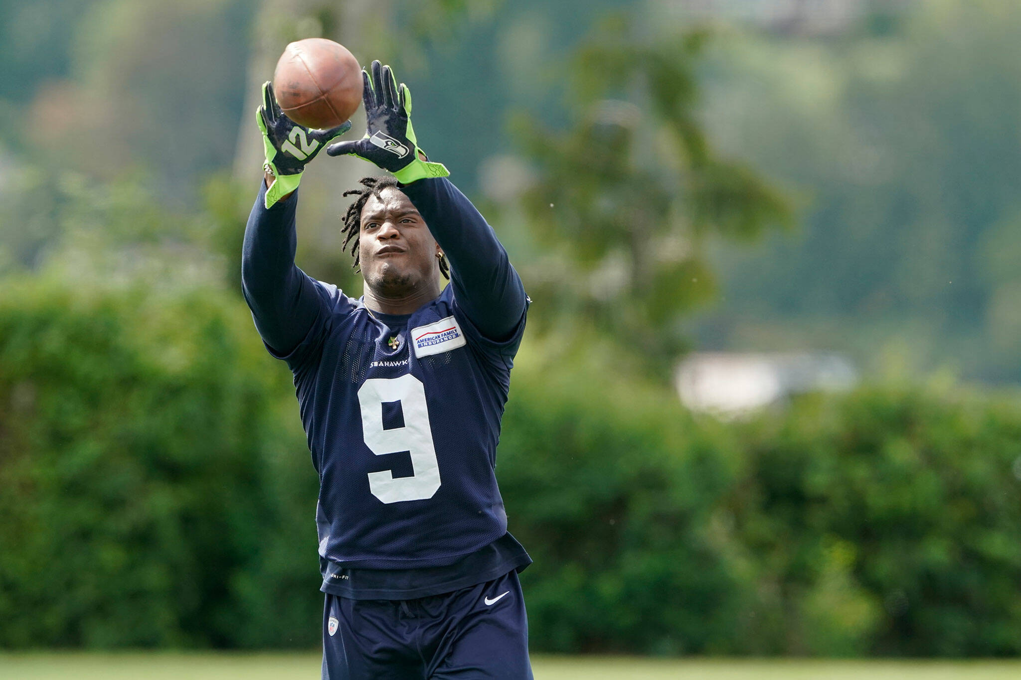 Seahawks running back Kenneth Walker makes a catch while working on extra drills following practice Wednesday in Renton. (AP Photo/Ted S. Warren)