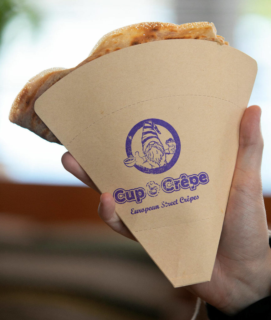 Cup & Crêpe’s gnome branding on a paper crepe holder. (Ryan Berry / The Herald)
