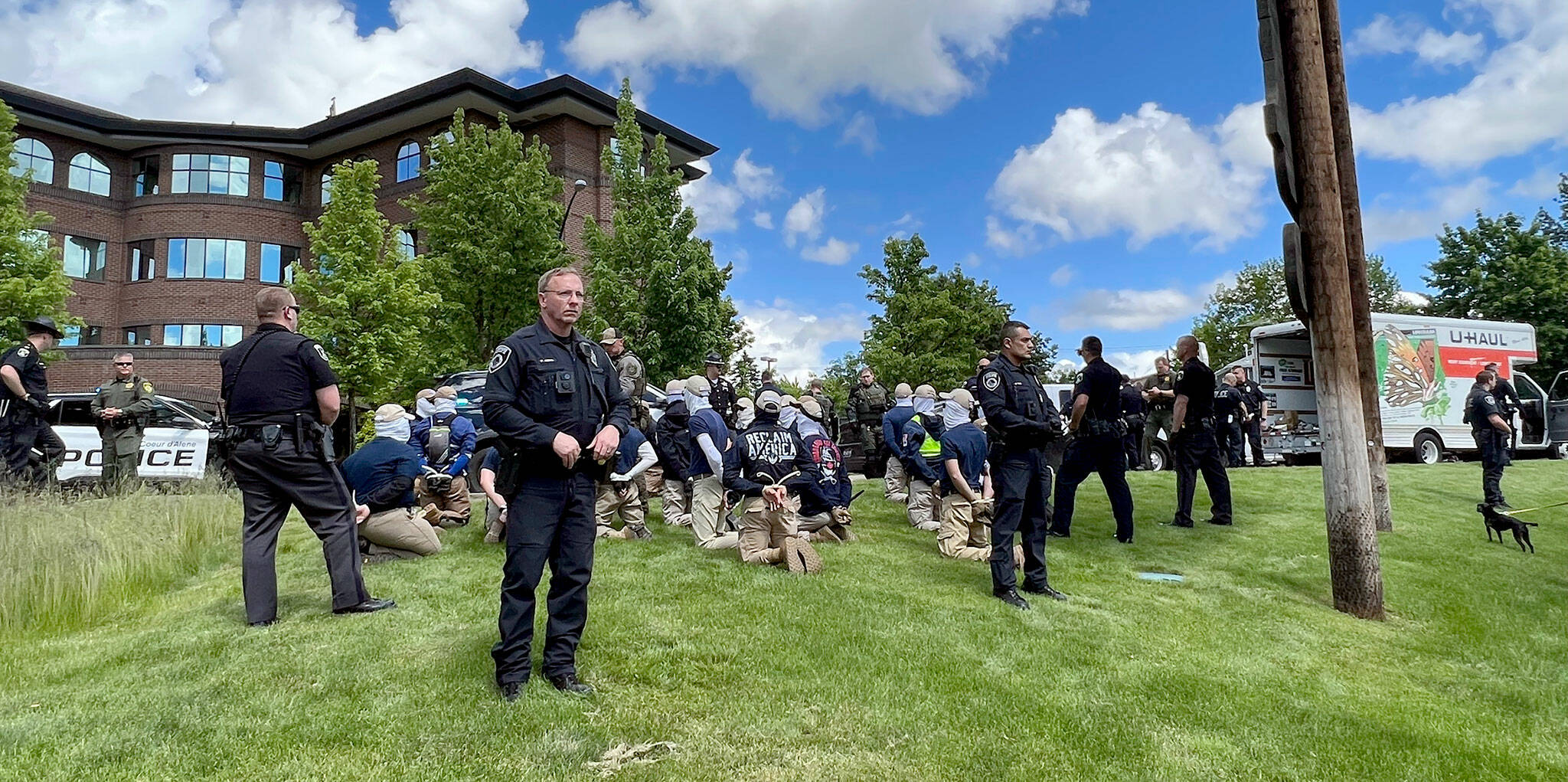 Authorities arrest members of the white supremacist group Patriot Front near an Idaho pride event Saturday after they were found packed into the back of a U-Haul truck with riot gear. (Georji Brown via AP)
