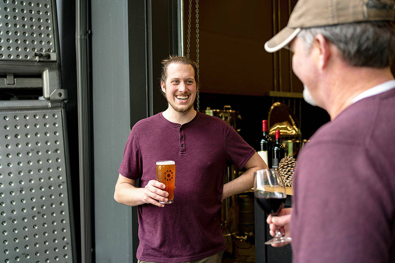 Hops & Seed head brewer Dru Seed (left) and owner John Bigelow share a pint at the Hops Seed taproom. (Caleb Smith)