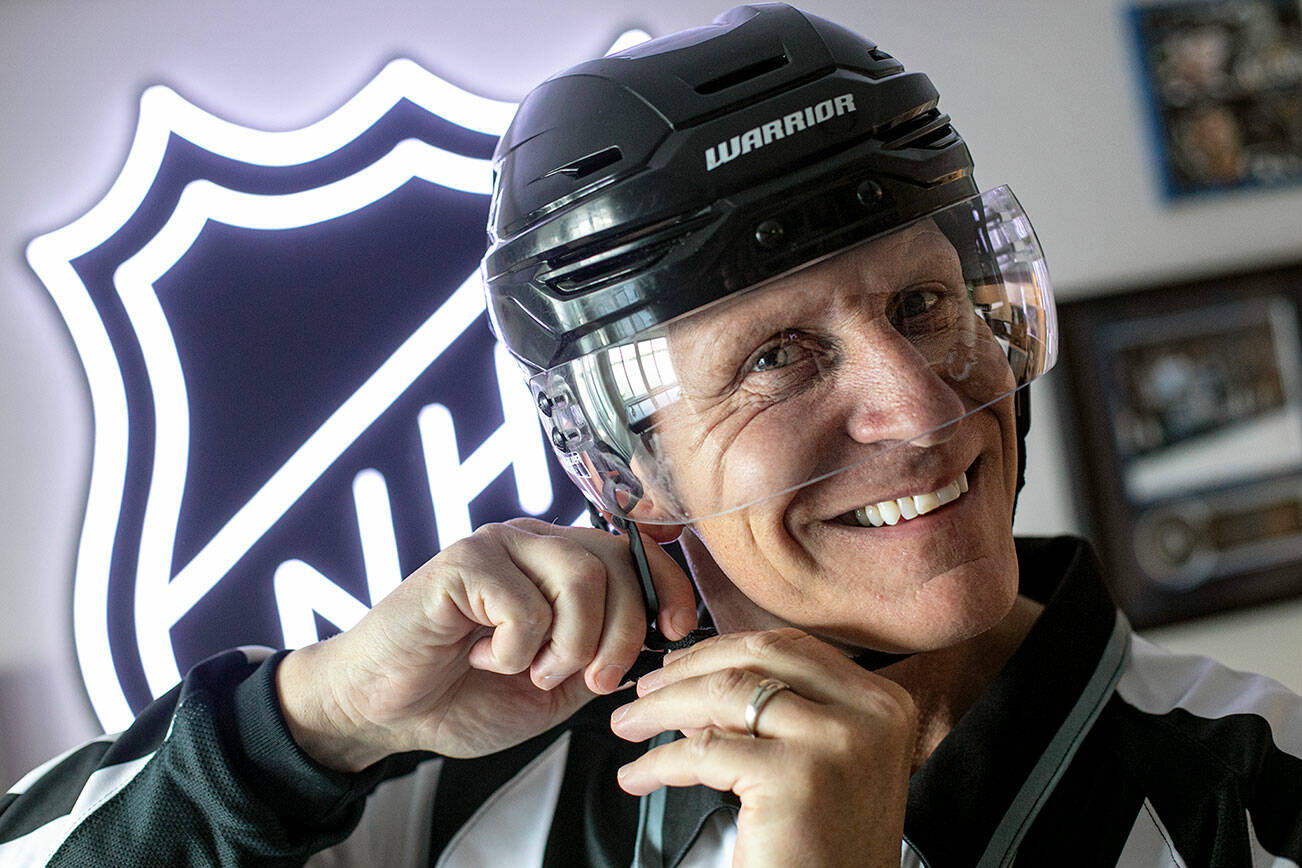 Vaughan Rody dons his linesman gear for the first time since his final NHL game in April, on Monday, June 6, 2022, at his home in Lake Stevens, Washington. Rody officiated in the National Hockey League for 23 seasons. (Ryan Berry / The Herald)