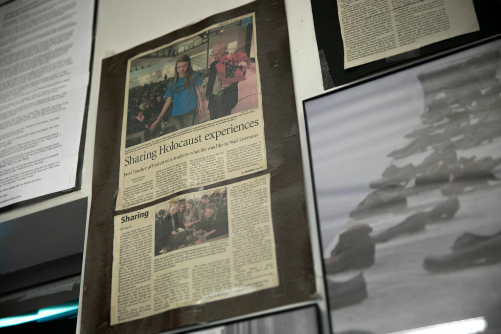 A collection of Holocaust-related material hangs on the wall in Emily Dykstra’s classroom at Cavelero Mid High School on Wednesday in Lake Stevens. (Ryan Berry / The Herald)
