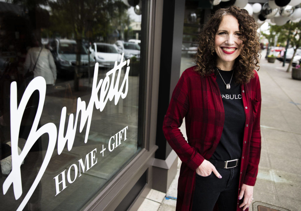 Holly Burkett-Pohland, the owner of Burkett’s Home & Gift, outside of her new storefront in Everett on Friday. (Olivia Vanni / The Herald)
