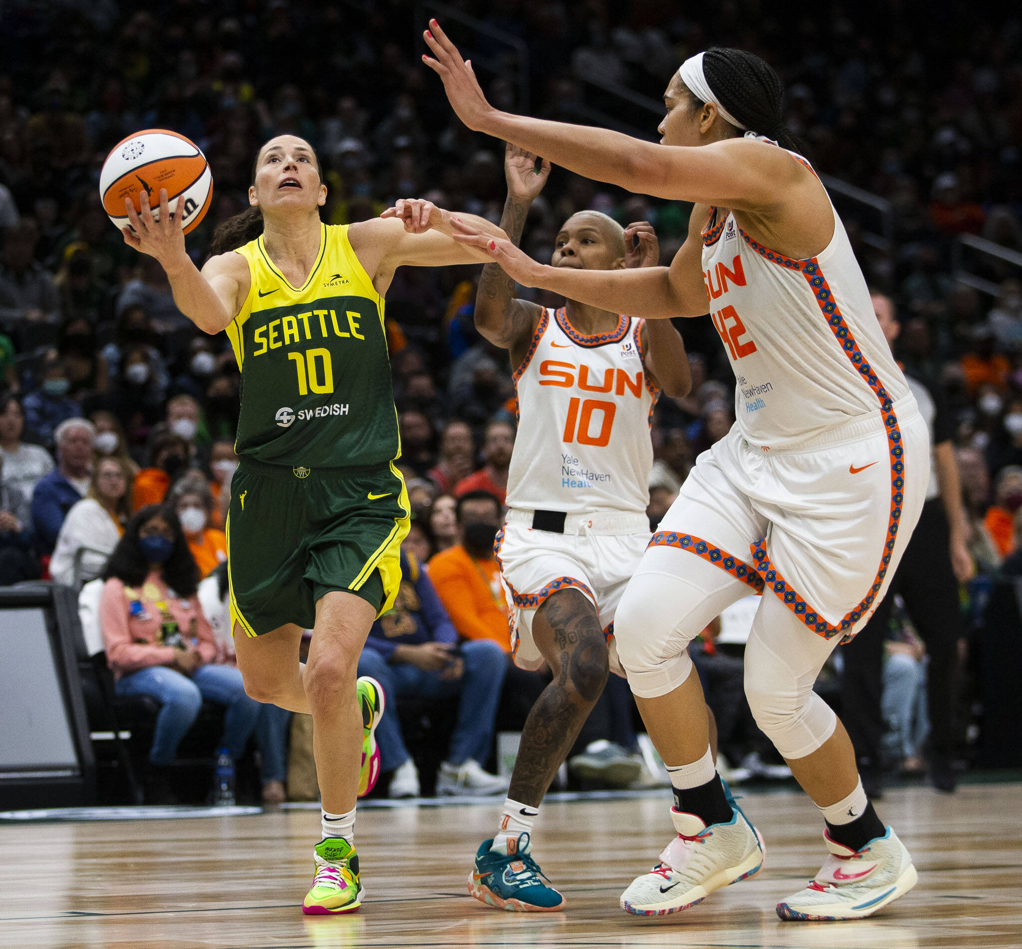 The Storm’s Sue Bird drives to the hoop for a layup during a game against the Sun on June 5, 2022, in Seattle. (Olivia Vanni / The Herald)