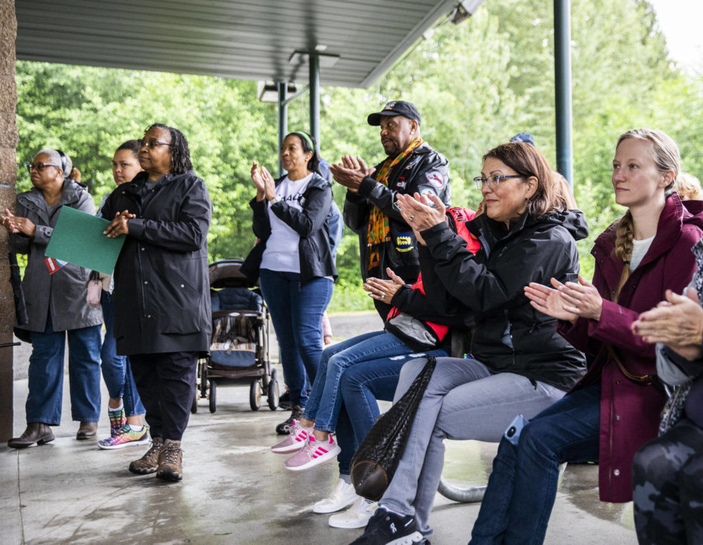 Community members and local politicians clap Saturday while listening to speakers at the Snohomish Juneteenth celebration. (Olivia Vanni / The Herald)
