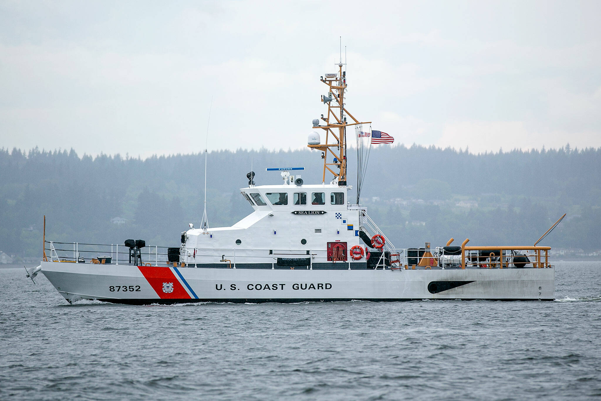 A U.S. Coast Guard patrol boat scours the waters off the coast of Mukilteo in search of a recreational diver who went missing hours earlier on Friday. (Ryan Berry / The Herald)