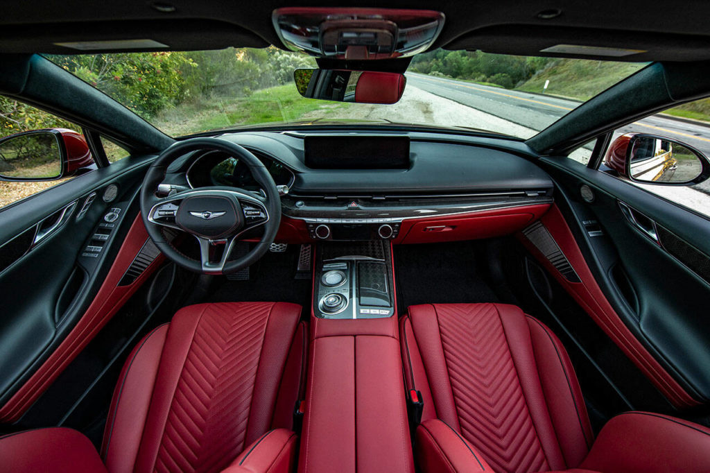 Genesis G80 3.5T AWD Sport trims come with a unique three-spoke steering wheel and a choice of diamond or V-pattern seat quilting. (Manufacturer photo) 
