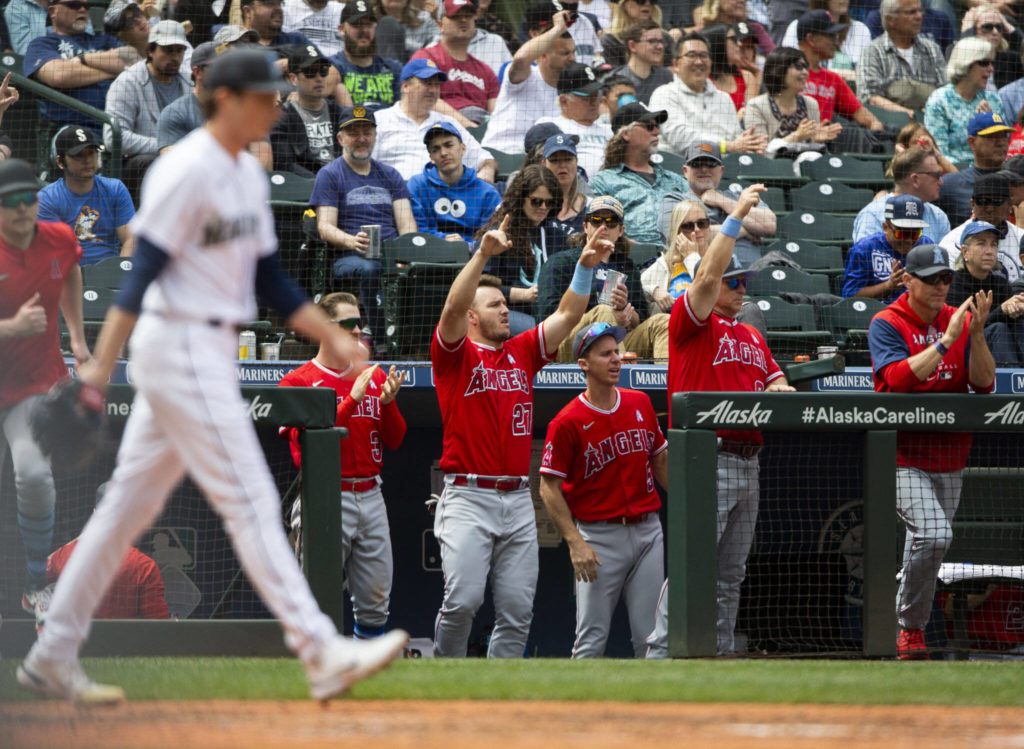 The Angels dugout reacts to a scoring hit during the game against the Angels on Sunday, June 19, 2022 in Seattle, Washington. (Olivia Vanni / The Herald)
