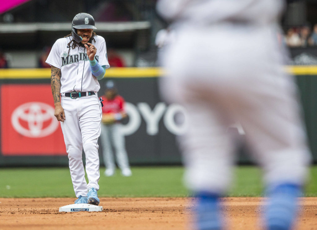 Mariners’ J.P. Crawford gestures to the first base coach during the game against the Angels on Sunday, June 19, 2022 in Seattle, Washington. (Olivia Vanni / The Herald)
