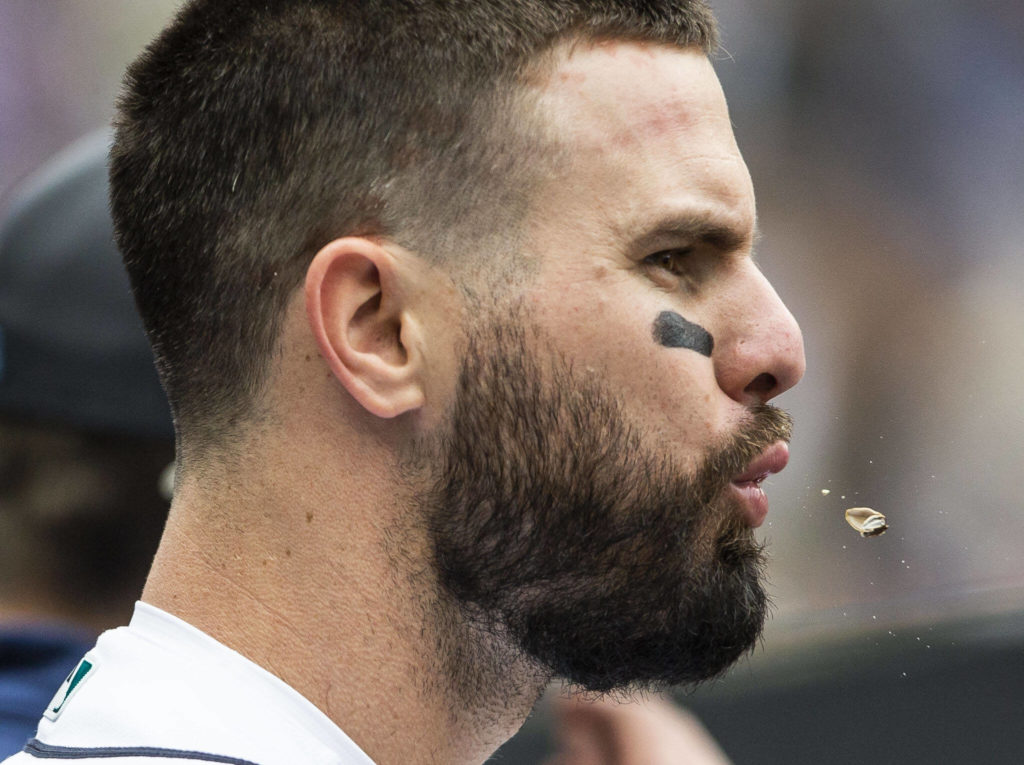 Mariners’ Jesse Winker spits out sunflower seed in the dugout during the game against the Angels on Sunday, June 19, 2022 in Seattle, Washington. (Olivia Vanni / The Herald)
