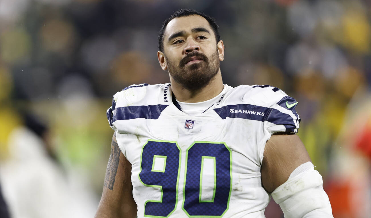 Seattle Seahawks defensive tackle Bryan Mone walks off the field after a game against the Green Bay Packers on Nov. 14, 2021, in Green Bay, Wis. (AP Photo/Kamil Krzaczynski)