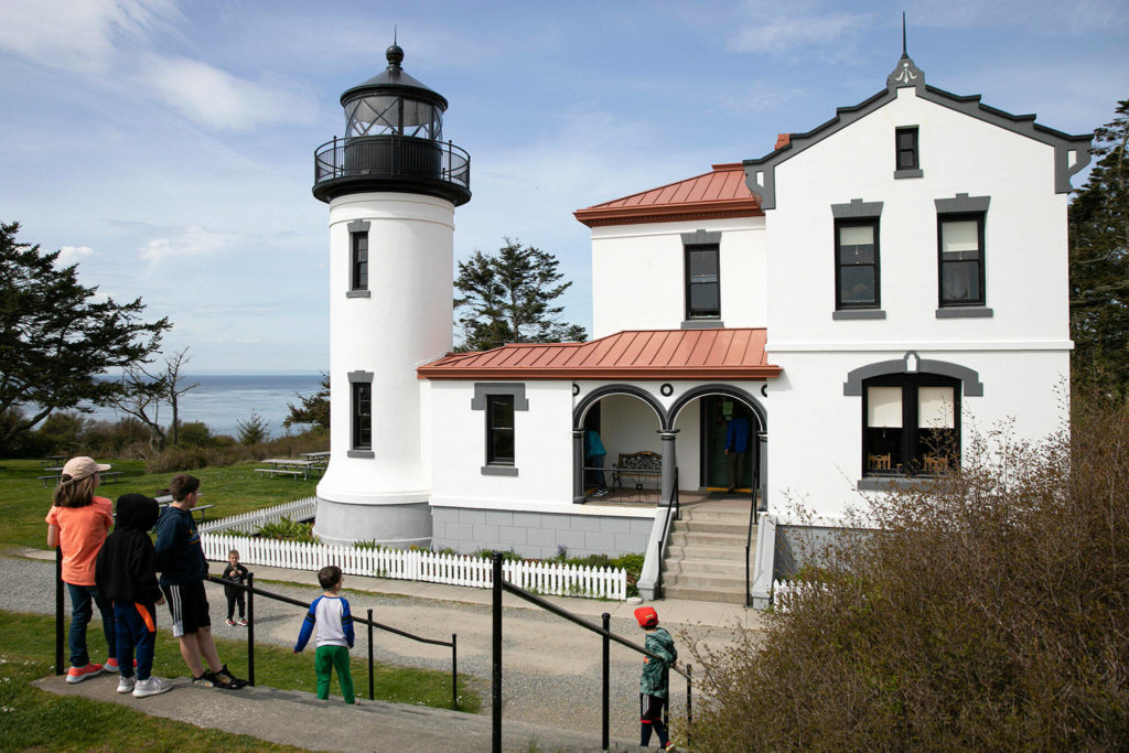 Children take a look at the restored Admiralty Head Lighthouse near Coupeville. (Ryan Berry / The Herald)
