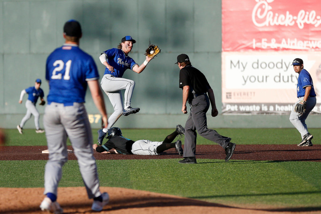 The Everett Merchants’ Cole Cramer, from Arlington, catches a throw down to second base during a game against the Seattle Blackfins on Wednesday, June 22, 2022, at Funko Field in Everett, Washington. (Ryan Berry / The Herald)
